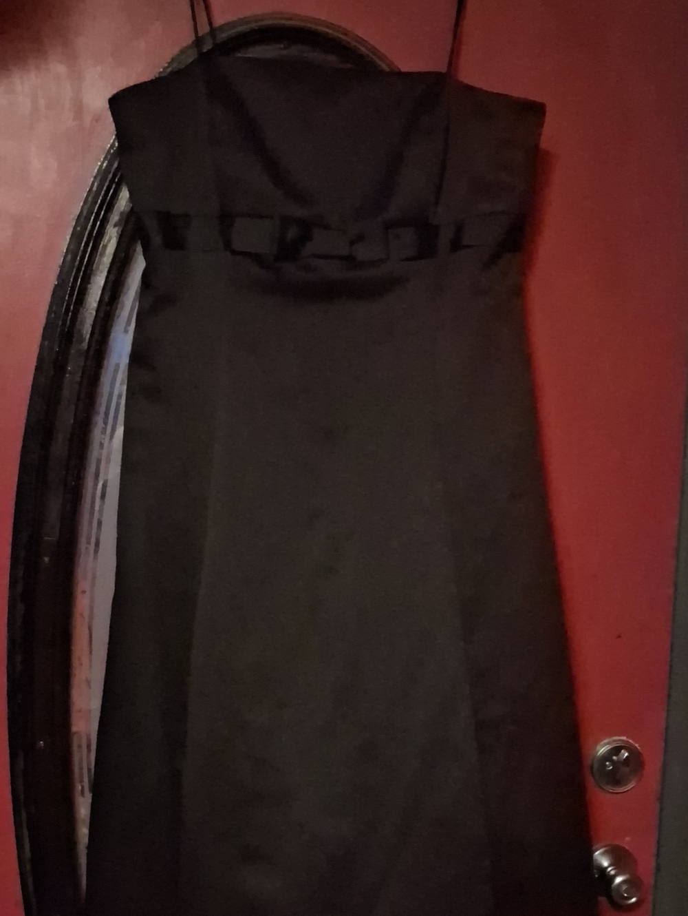 David's Bridal Black Strapless Formal Dress with Bow Accent.